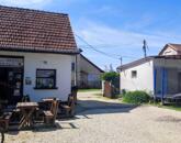 Eladó családi ház üzlethelyiséggel, garázzsal Szandaszőlősön